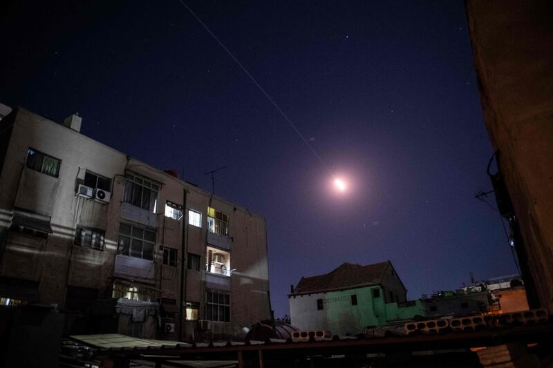 Flares of Syrian air defence rockets are seen in the sky of Damascus. AFP