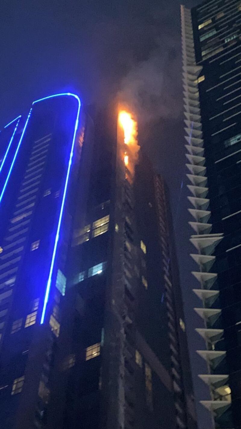 Flames rise up Duja Tower near Trade Centre roundabout on Thursday night. The blaze has left residents temporarily without homes. Supplied image