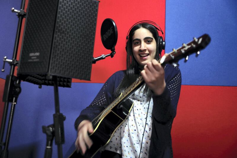 DUBAI ,  UNITED ARAB EMIRATES , JULY 1 -2019 :- Sara Al Hashimi, student of KING’s School Al Barsha Dubai, has autism and has managed to win a scholarship to the music college at Berklee singing at the music room at the school campus in Dubai. ( Pawan Singh / The National ) For News. Story by Anam