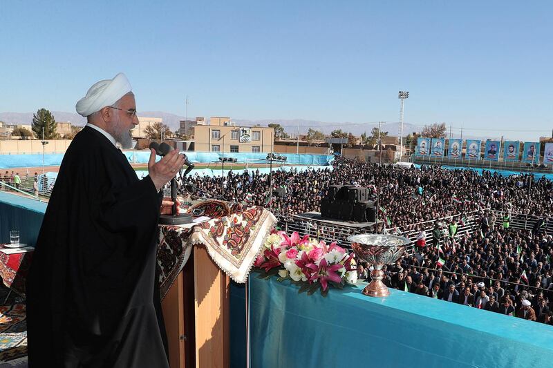 In this photo released by the official website of the office of the Iranian Presidency, President Hassan Rouhani speaks at a public gathering in the city of Rafsanjan in Iran's southwest Kerman province, Monday, Nov. 11, 2019. Rouhani on Monday called on hard-liners to support the country's troubled nuclear deal, saying it could open up international arms sales for the Islamic Republic next year. (Office of the Iranian Presidency via AP)