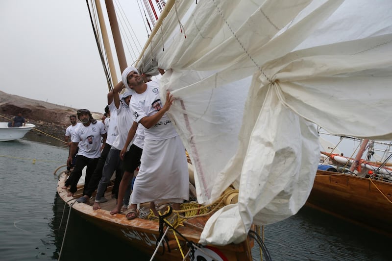 A dhow crew checks their main sail ahead of the race Kamran Jebreili / AP Photo