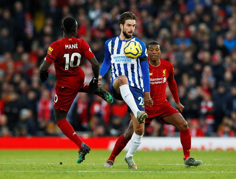 Brighton's Davy Propper in action with Liverpool's Sadio Mane and Georginio Wijnaldum. Reuters