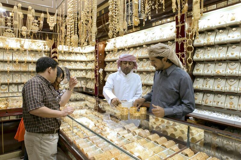 Shoppers inside a gold jewellery shop in Deira, Dubai. Spot gold closed at $1,275.50 on Friday on the Comex in New York. Reem Mohammed / The National  