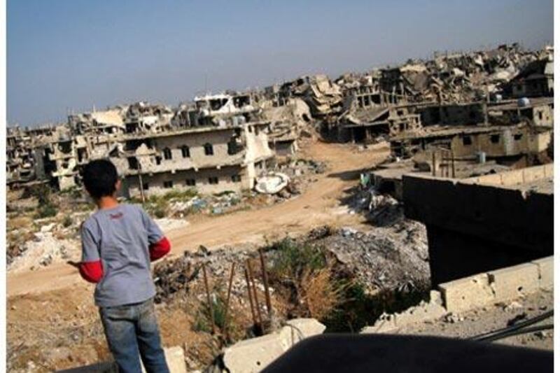 A Palestinian boy looks out at buildings destroyed during the 105-day siege of the Nahr al Bared refugee camp.