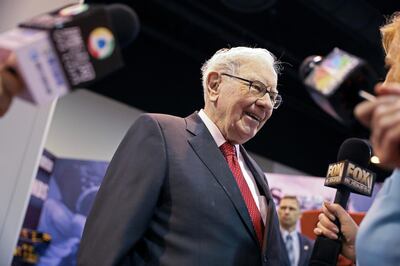 FILE PHOTO: Berkshire Hathaway Chairman Warren Buffett walks through the exhibit hall as shareholders gather to hear from the billionaire investor at Berkshire Hathaway Inc's annual shareholder meeting in Omaha, Nebraska, U.S., May 4, 2019. REUTERS/Scott Morgan -/File Photo