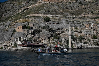People enjoy a boat tour on a lake in Halfeti. AFP