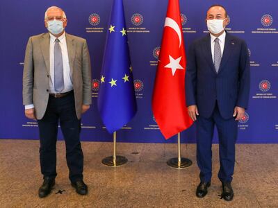 Turkey's Foreign Minister Mevlut Cavusoglu, right, and Josep Borrell Fontelles, High RepresentativeÂ and Vice-PresidentÂ of the European Commission, pose for photos before a meeting, in Ankara, Turkey, Monday, July 6, 2020.  Cavusoglu and Borrell has discussed Turkey-EU relations, regional issues, Libya and Syria. (Cem Ozdel/Turkish Foreign Ministry via AP, Pool)