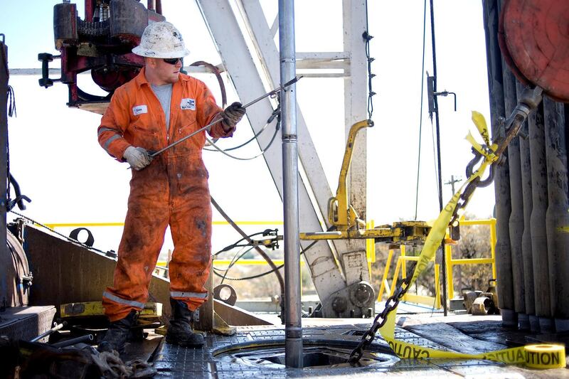 Baker Hughes Operator Drew Troyer (cq) conducts a wireline survey on a Chesapeake Energy natural gas rig drilling in the North Texas Barnett Shale bed rock deposit in Burleson, Texas, Monday, March 16, 2009. Natural gas futures have fallen in New York after a government report showed that slowing industrial demand during the recession has widened a supply surplus.

PHOTOGRAPHER: MATT NAGER/ BLOOMBERG NEWS