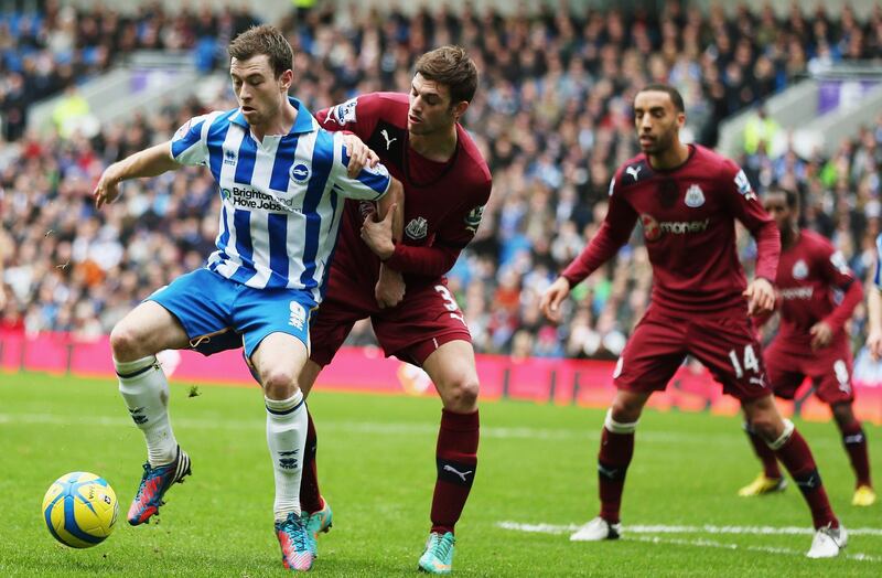 BRIGHTON, ENGLAND - JANUARY 05: Ashley Barnes  of Brighton & Hove Albion holds off Davide Stanton of Newcastle United during the FA Cup with Budweiser Third Round match between Brighton & Hove Albion and Newcastle United at the Amex Stadium on January 5, 2013 in Brighton, England.  (Photo by Bryn Lennon/Getty Images)