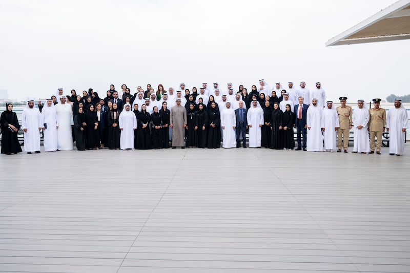 President Sheikh Mohamed stands for a photograph with the team overseeing Cop28 preparations
