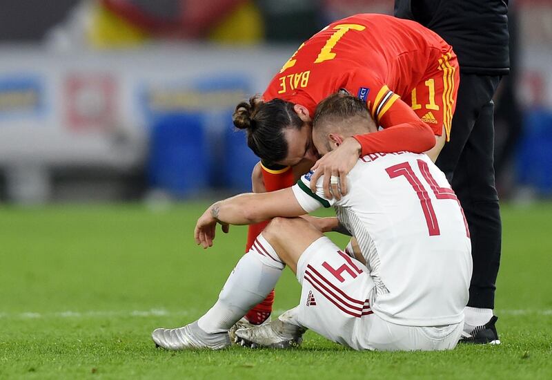 Gareth Bale of Wales consoles dejected Hungary  player Gergo Lovrencsics. EPA