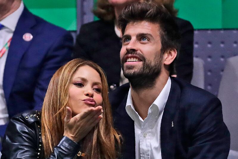 Colombian singer Shakira blows a kiss next to her husband Barcelona soccer player Gerard Pique in happier days for their relationship. AP