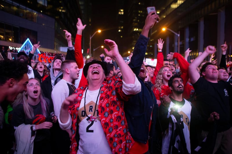 Toronto Raptors fans celebrate. AP Photo