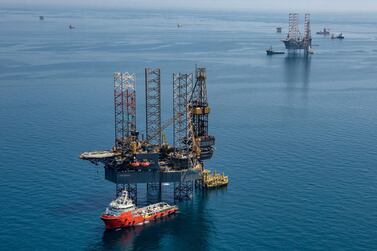 Rigs in the offshore Hasbah field, Saudi Arabia. Aramco will trim its total output for May and June to 7.492m bpd. EPA