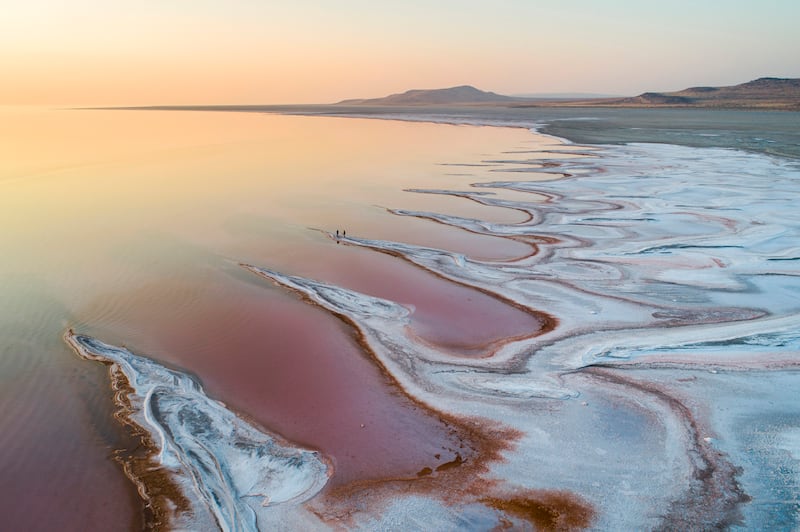 Visitors on the salt flats watching the sunset over the Great Salt Lake, Utah. The  lake has lost 50 per cent of its volume since the arrival of Mormon pioneers in 1847.  EPA