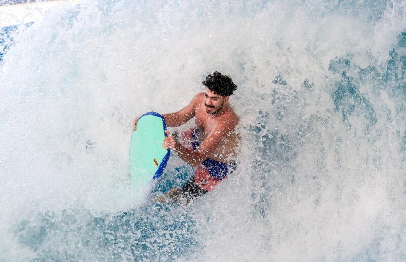 Abu Dhabi, United Arab Emirates, August 4, 2020.   Yas Waterworld Abu Dhabi opens with 30% capacity as Covid-19 restrictions slowly come to an ease.  A body boarder flips the waves at the waterpark.
Victor Besa /The National
Section: NA
Reporter: