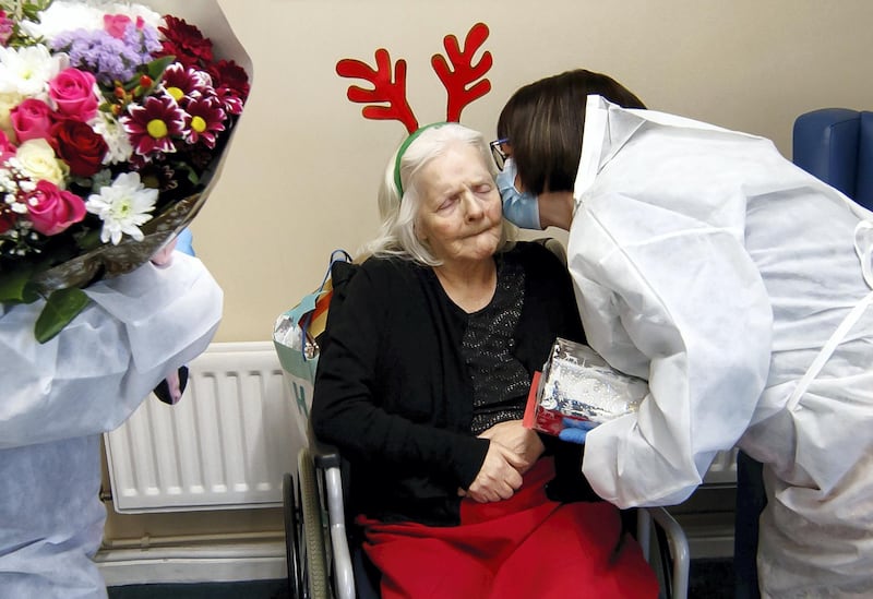 Mary Orme (right) and embraces her mother Rose McKimm, during a Christmas Day visit at Aspen Hill Village care home in Hunslet, Leeds. The care home is able to host almost 50 visits for family members this Christmas after running successful trials of lateral flow testing for coronavirus. (Photo by Danny Lawson/PA Images via Getty Images)