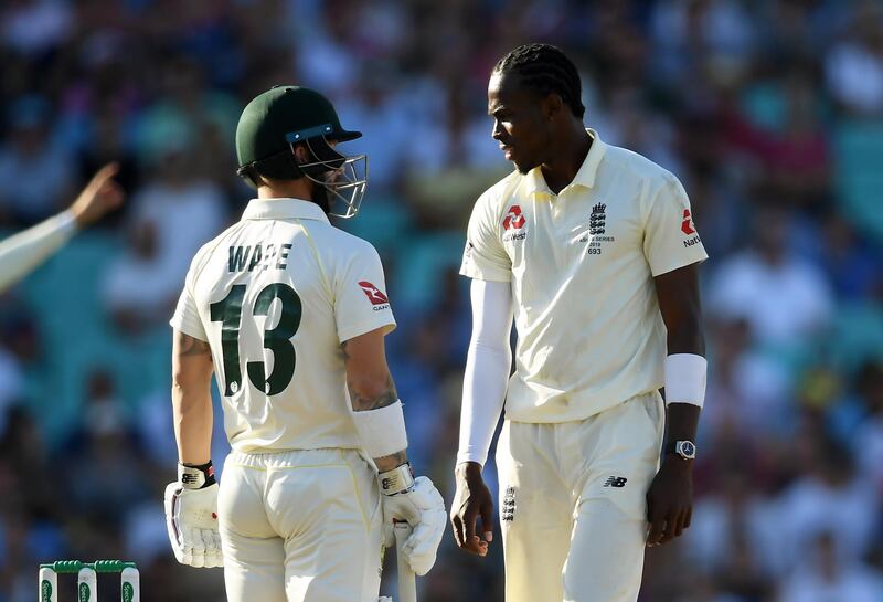 Jofra Archer, right, and Matthew Wade during Sunday's play at The Oval. Getty