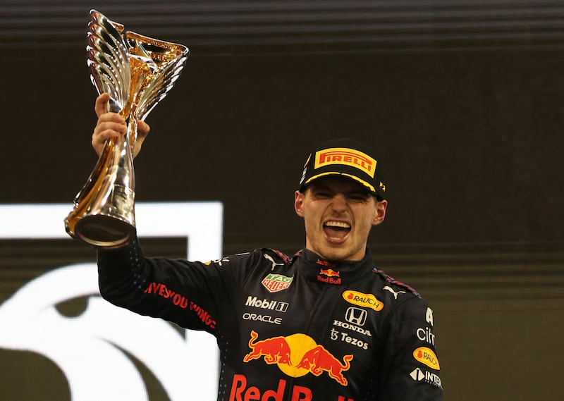 Red Bull's Max Verstappen celebrates winning the Abu Dhabi Grand Prix and the Formula One world championship on Yas Island on December 12. Reuters