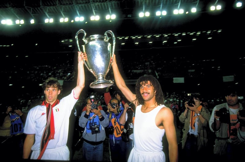 24 May 1989:  Marco Van Basten (left) and Ruud Gullit (right) of AC Milan celebrate with the trophy after winning the European Cup Final match against Steaua Bucuresti at Nou Camp in Barcelona, Spain. AC Milan won the match 4-0. \ Mandatory Credit: SimonBruty/Allsport