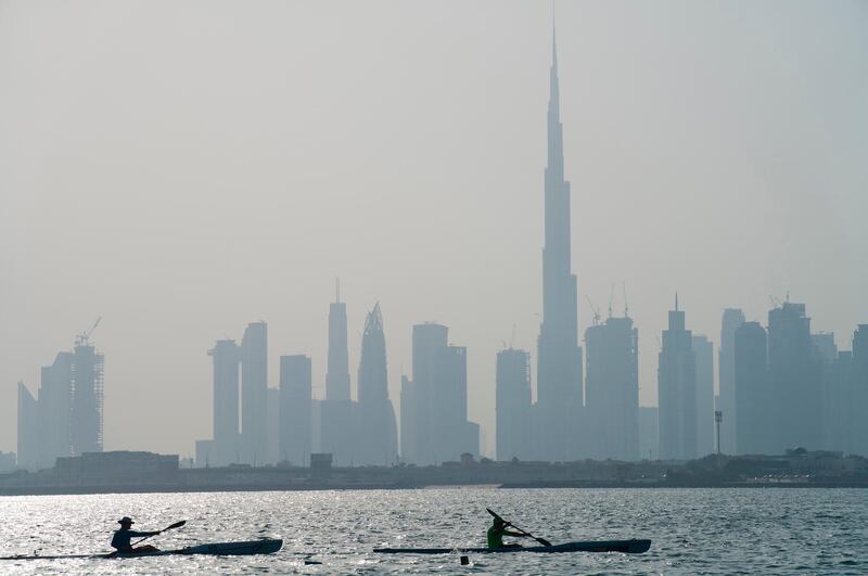 Kayakers race in front of the Burj Khalifa, the world's tallest building, off the coast of Dubai. AP Photo