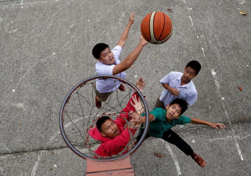 Students play basketball at Mae Sai Prasitsart school, where some of the members of an under-16 soccer team that went missing with their coach at a flooded cave were studying at, in the northern province of Chiang Rai, Thailand. Soe Zeya Tun / Reuters