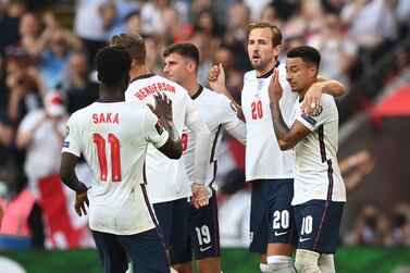 LONDON, ENGLAND - SEPTEMBER 05: Harry Kane of England celebrates with Jesse Lingard after scoring their team's second goal from the penalty spot during the 2022 FIFA World Cup Qualifier match between England and Andorra at Wembley Stadium on September 05, 2021 in London, England. (Photo by Shaun Botterill / Getty Images)