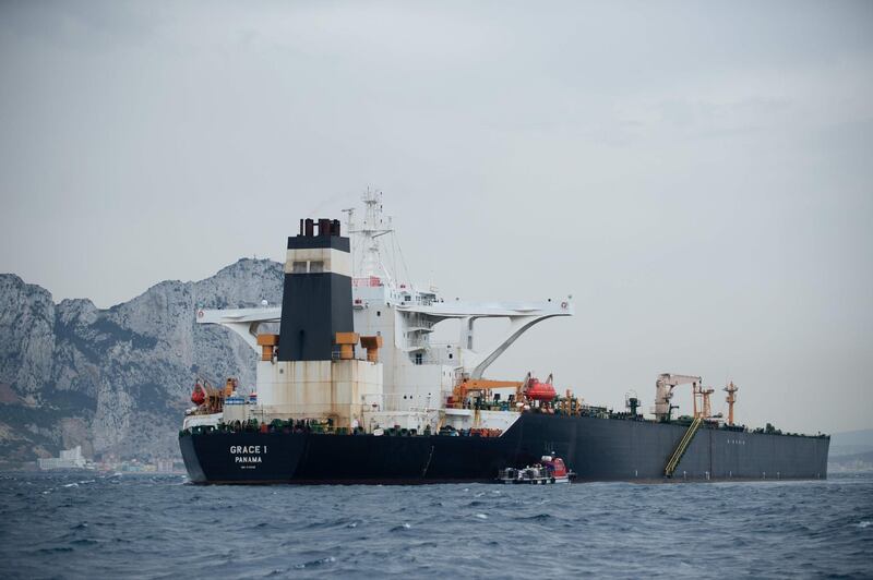 (FILES) In this file photo taken on July 06, 2019 A picture shows supertanker Grace 1 off the coast of Gibraltar on July 6, 2019. Gibraltar police have arrested the Indian captain and chief officer of a seized Iranian tanker suspected of breaching EU sanctions by shipping oil to Syria, a spokesman for the Royal Gibraltar Police said on July 11, 2019. Iran demanded on July 5, 2019 that Britain immediately release an oil tanker it has detained in Gibraltar, accusing it of acting at the bidding of the United States. Authorities in Gibraltar, a British overseas territory on Spain's southern tip at the western entrance to the Mediterranean, said they suspected the tanker was carrying crude to Syria in violation of EU sanctions. / AFP / JORGE GUERRERO
