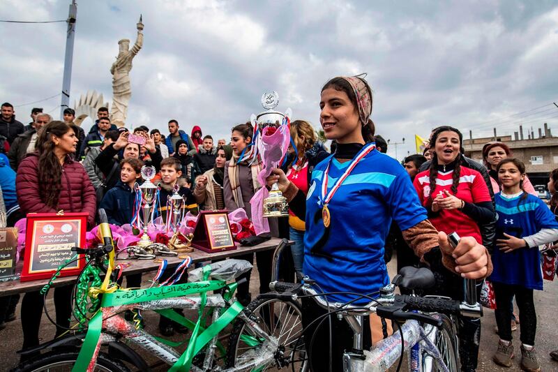 Kurdish women take part in a cycling marathon in the northeastern Syrian town of Amuda in Hasakeh province. AFP