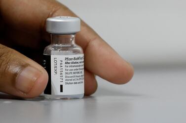 A medical worker prepares to dilute a vial of Pfizer-BioNTech vaccine at a Covid-19 vaccination centre, March 8, 2021. Reuters