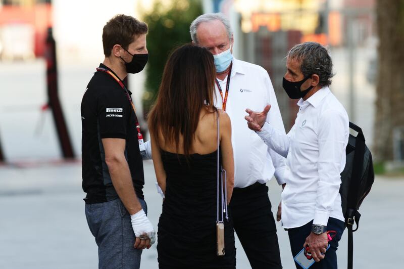 Romain Grosjean with his wife Marion, Alain Prost, special advisor to Renault, and Renault Sport CEO Jerome Stoll. Getty