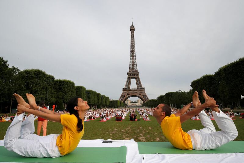 People gather for an open-air yoga session near the Eiffel Tower in Paris, France. Philippe Wojazer / Reuters