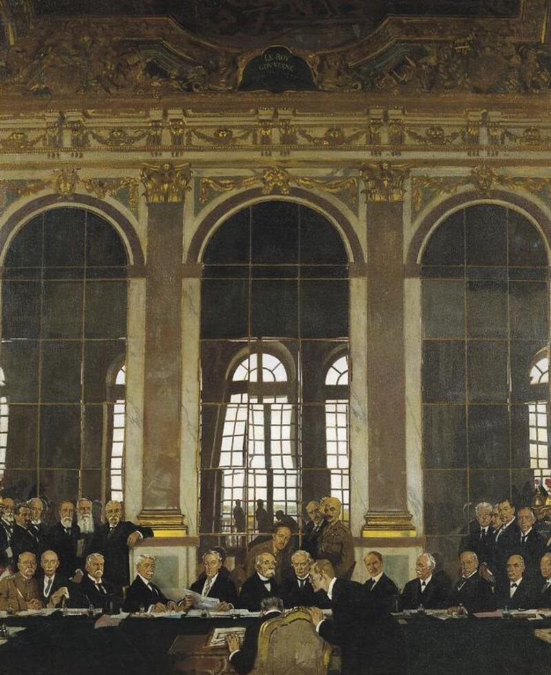 Woodrow Wilson, seated fifth from left, with Clemenceau of France and Lloyd George of the United Kingdom, at the signing of the Treaty of Versailles in 1919, whose harsh terms laid the way for the next war. Sir William Orpen / IWM via Getty Images/ May 2014