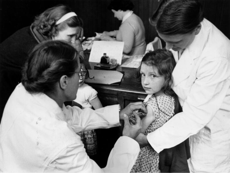A child is injected with a vaccine against polio in 1956, the first stage of the biggest vaccination programme ever undertaken in Britain at the time. 