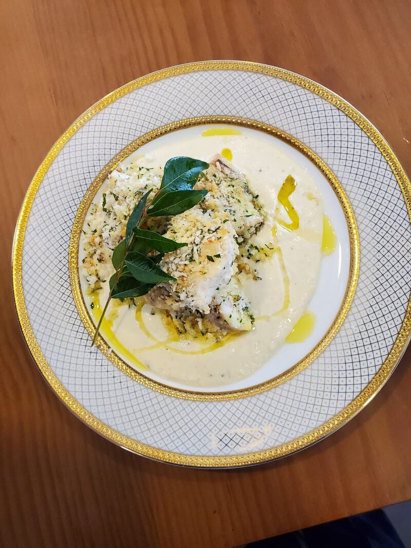 Mahi-e mast-gerdu, an Iranian-style yoghurt-baked hamour with walnut and herb crumbs.