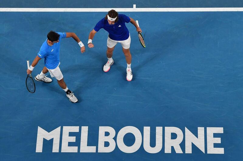 Greek duo Michail Pervolarakis, left, and Stefanos Tsitsipas as they play against Australia's Luke Saville and John Peers during their group B men's doubles tennis match at the ATP Cup in Melbourne on Wedensday, February 3. The Austraian's won the match 6-3, 4-6, 7-6. AFP