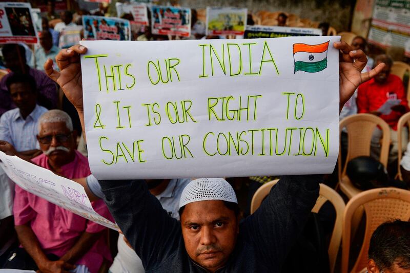 A demonstrator holds a placard to protest against the legislation in Chennai. AFP