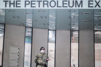 epa08353338 An Austrian Armed Forces soldier wearing a face mask patrols in front of the Organization of Petroleum Exporting Countries (OPEC) headquarters in Vienna, Austria, 09 April 2020. According to reports Ministers of the OPEC member states discuss SARS-CoV-2 coronavirus, which causes the Covid-19 disease, effects on the oil business in a video conference today.  EPA/CHRISTIAN BRUNA