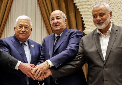 From left, Palestinian President Mahmud Abbas, Algerian President Abdelmajid Tebboune and Palestinian Hamas movement leader Ismail Haniyeh in Algiers. AFP