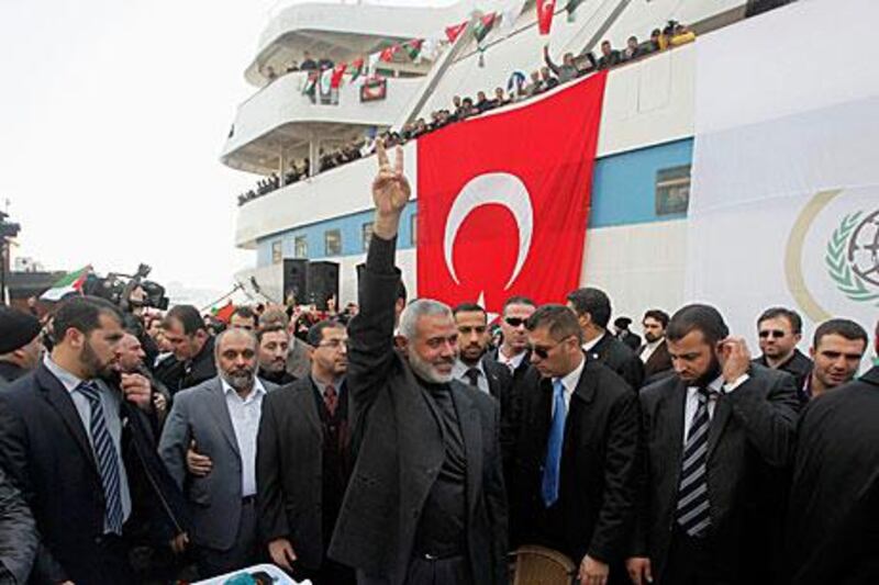 Ismail Haniyeh, the Hamas premier, raises a victory sign in front of the flotilla vessel the Mavi Marmara in Istanbul today.