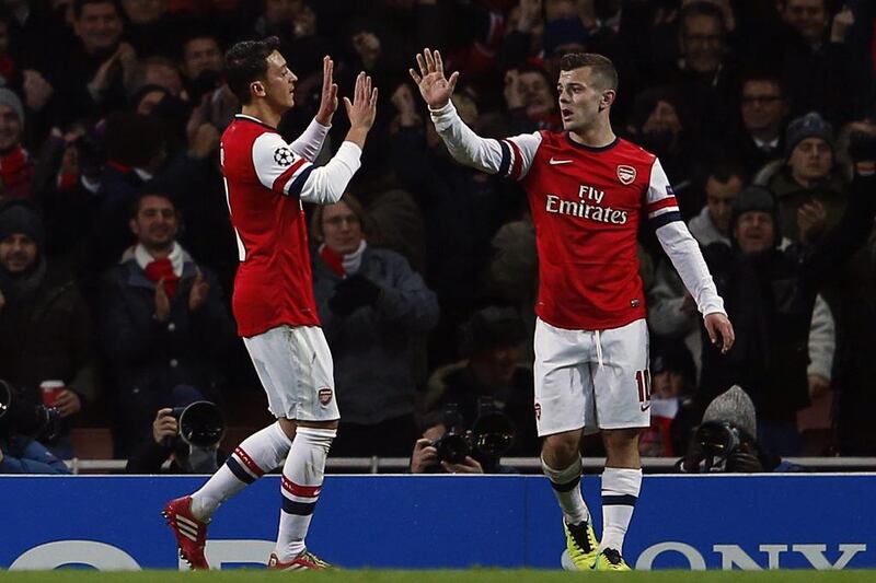 Jack Wilshere, right, scored twice for Arsenal on Tuesday night. Eddie Keogh / Reuters