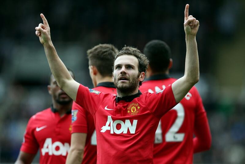 Juan Mata celebrates after scoring during an English Premier League match against Newcastle United on April 5, 2014. Ian MacNicol / AFP