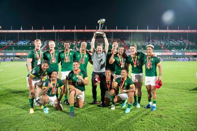 South Africa with the trophy after winning the World Series Men’s Finals at Dubai Sevens against Argentina. Ruel Pableo for The National