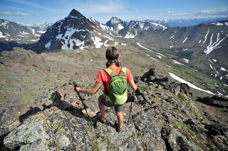 Hikers on the ridge that connects Flattop Mountain, Peak 2, Peak 3, and Flaketop to Ptarmigan Pass in Chugach State Park near Anchorage, Alaska June 2011. The four-mile traverse is a popular local hike and suitable for trail running. Getty Images