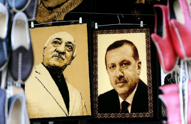 Embroidered images of United States-based Turkish cleric Fethullah Gulen and Turkey's prime minister Recep Tayyip Erdogan are displayed in a shop in the Gaziantep market on January 17 in Gaziantep, near the Turkish-Syrian border. Ozan Kose/AFP Photo 