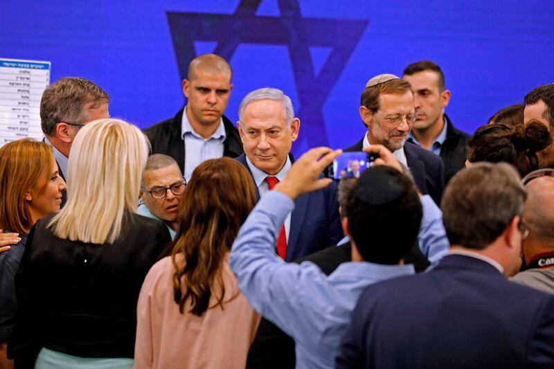 Israeli Prime Minister Benjamin Netanyahu  meets with people after giving a statement. AFP