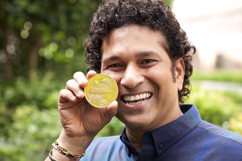 Sachin Tendulkar with the 24-carat gold coin issued in his honour. Courtesy East India Company