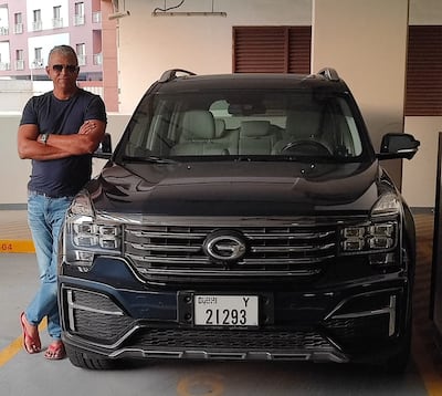 Dubai resident Sultan Qazi with his GAC Trumpchi, which he drives after years behind the wheels of German cars. Photo: Sultan Qazi