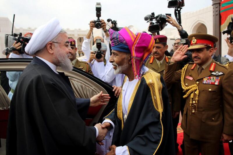 Iranian president Hassan Rouhani shakes hands with Sultan Qaboos in Muscat, Oman, February 15, 2017. President.ir/Handout via REUTERS 