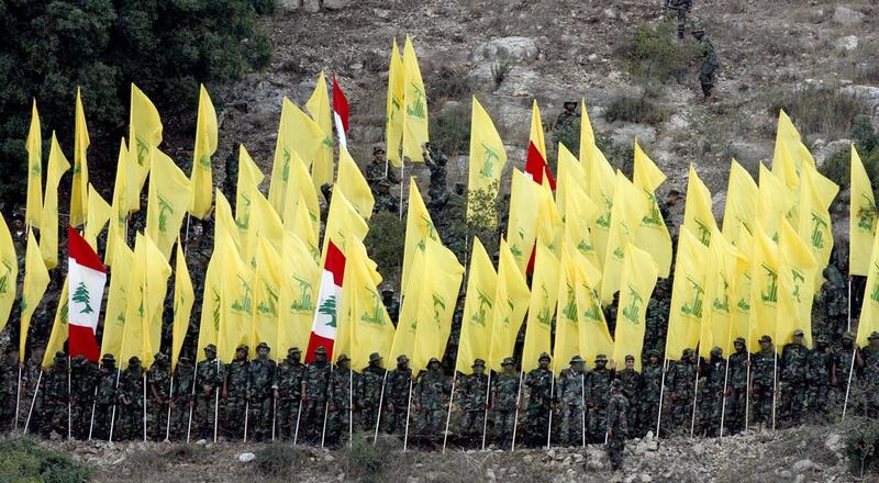 Hizbollah militia members listening to the speech of their leader Hassan Nasrallah via a giant screen on August 14, 2015, during the 'Victory Festival' to mark the 9th anniversary of the end of the 2006 July War between Hizbollah and Israel in Wadi Al Hujeir area, southern Lebanon. EPA